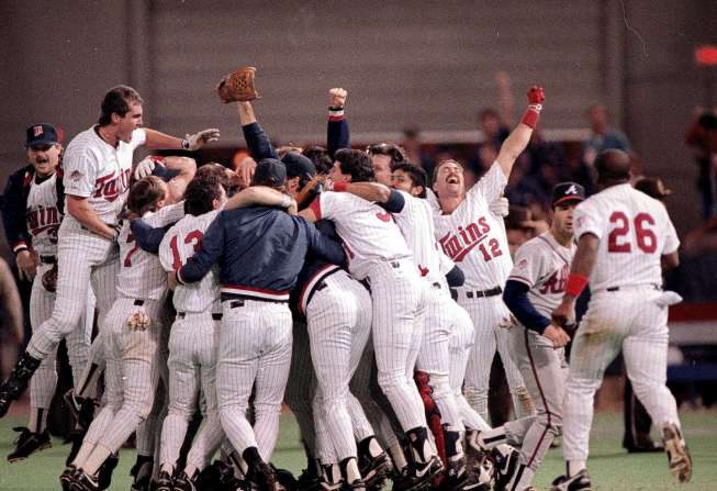 A group of baseball players celebrating on the field.