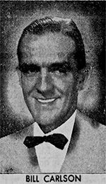 A black and white photo of a man in a suit.