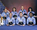 A group of people in blue suits and helmets.