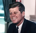 A close up of john f. Kennedy smiling for the camera