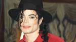 A man in red shirt and black hat.