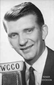 A man with a tie and a badge