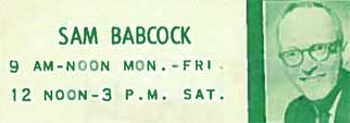 A green and white sign with the words babcock