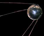 A large metal ball with long wires attached to it.